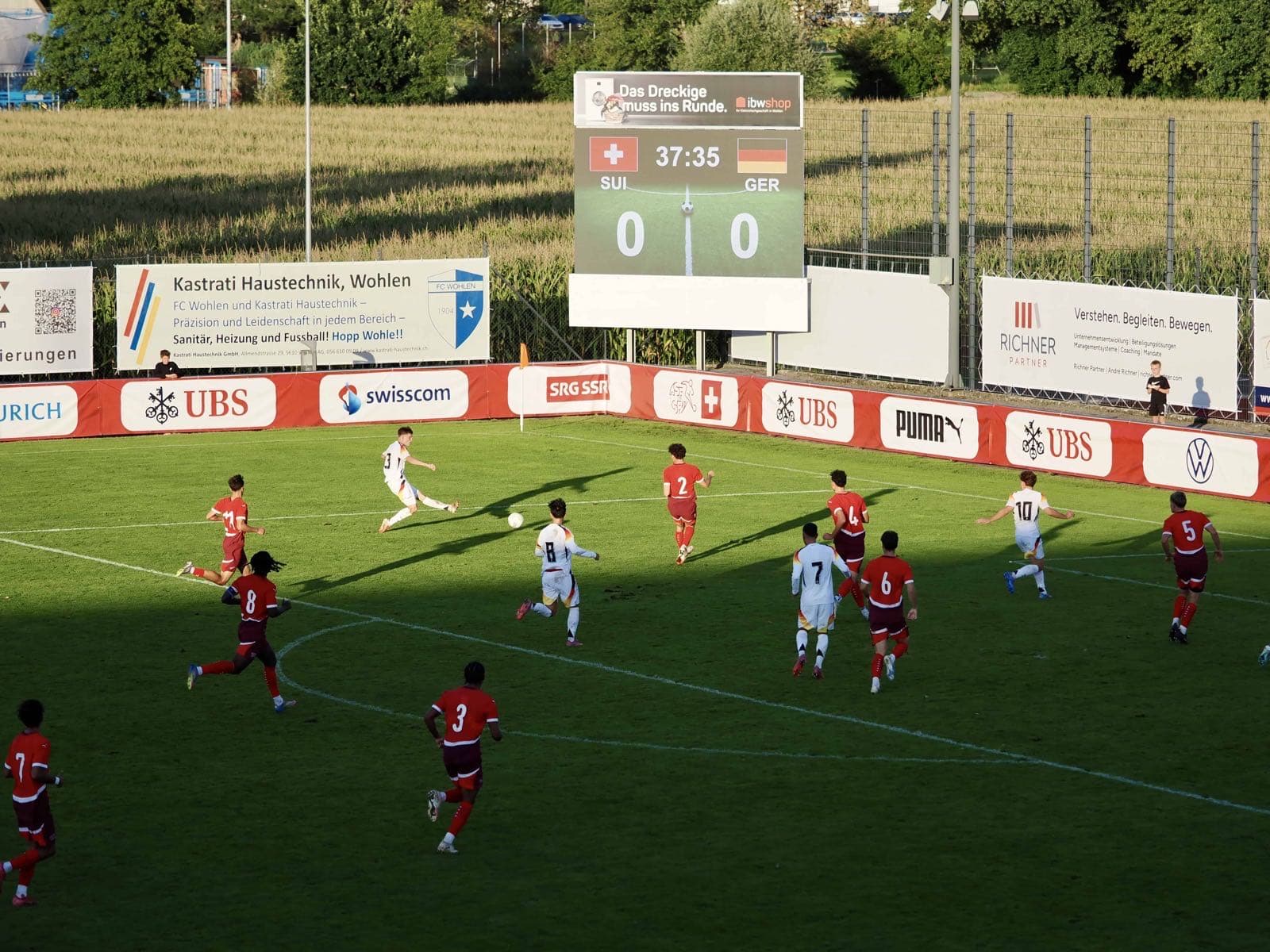 Scoreboard running LemonScore behind the advertising boards at the U20 international Switzerland v Germany